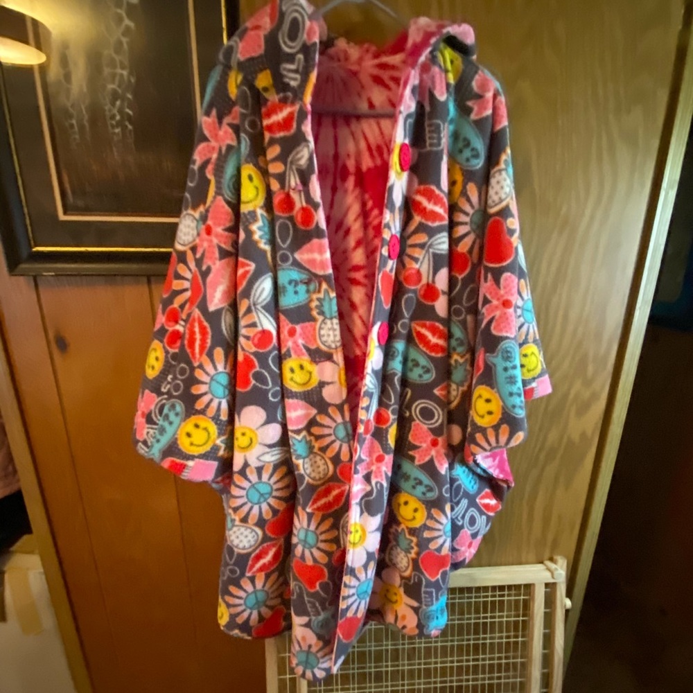 Reversible coat-like cape with hood